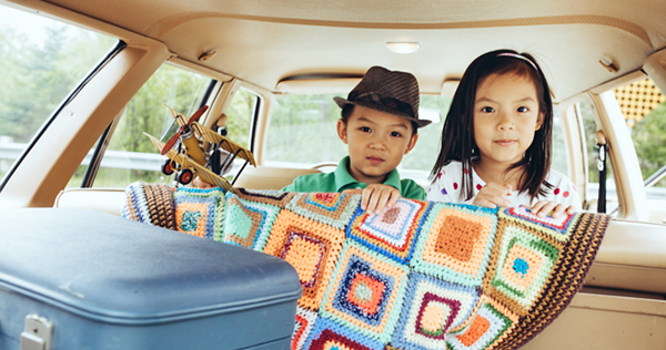 brother and sister in back seat of car