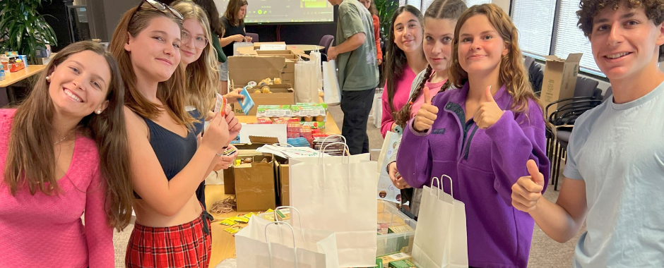 teens volunteers preparing gift bags