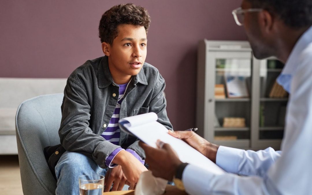 Teen adolescent receiving support from therapist